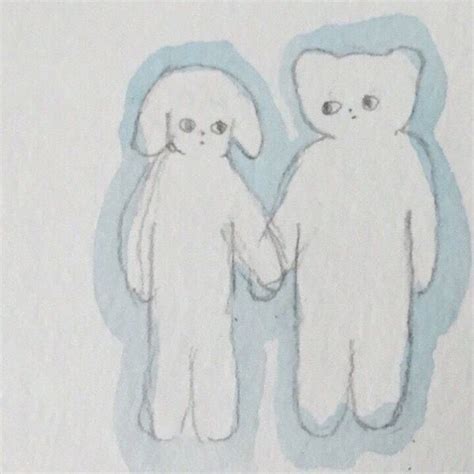 Two White Teddy Bears Holding Hands In Front Of A Blue And White