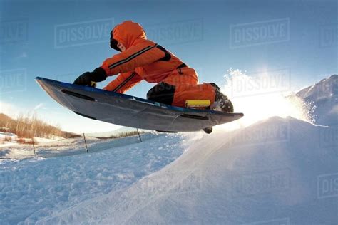 Person Tobogganing Stock Photo Dissolve