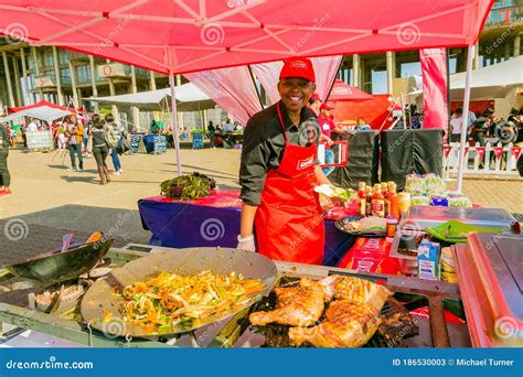 Diverse African Vendors Cooking And Serving Various Bread Based Street