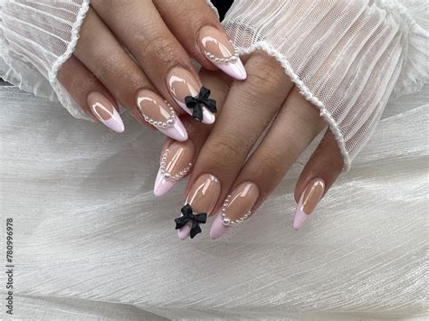 Cute Girl Hands With Acrylic Nails Set In Nude Base Color And Light Pink Frech Tip Design Added