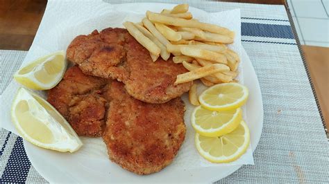 [homemade] German Pork Schnitzel With Fries N Lemon R Food