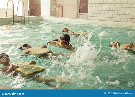 Elementary School Children Within Swimming Skills Lesson Editorial