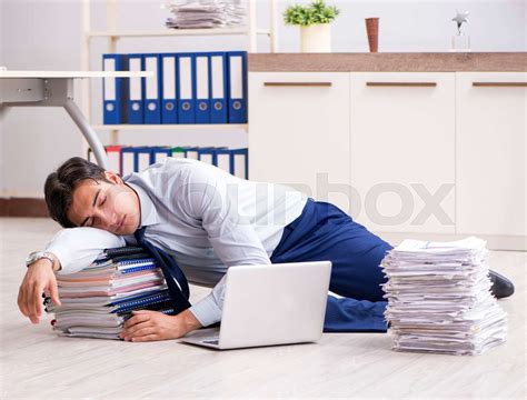 Extremely Busy Employee Working In The Office Stock Image Colourbox