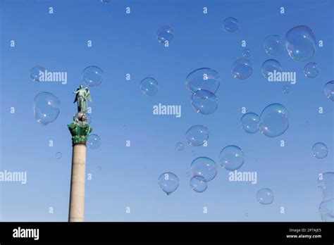 Soap bubbles above the Schlossplatz with Jubilee Column and the Roman ...