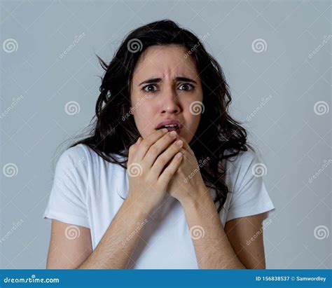 Portrait Of A Young Attractive Woman Looking Scared And Shocked Human