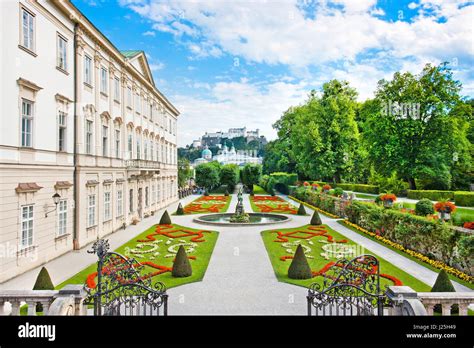 Beautiful view of famous Mirabell Gardens with Mirabell Palace and the old historic Fortress ...