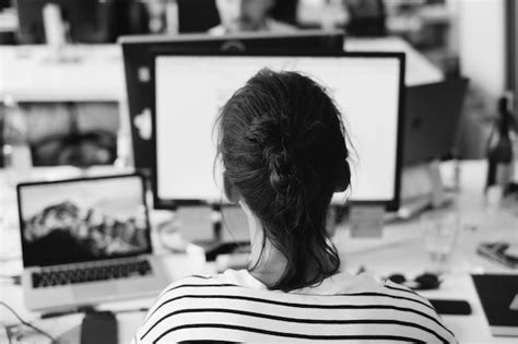 Premium Photo Rear View Of Woman Using Laptop