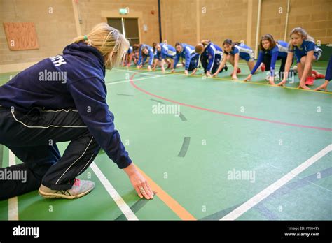 A Teacher Gives A Physical Education Pe Lesson Inside The Gymnasium