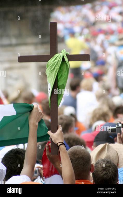 Ministrants hold up a cross on St. Peter's Square in Vatican City ...