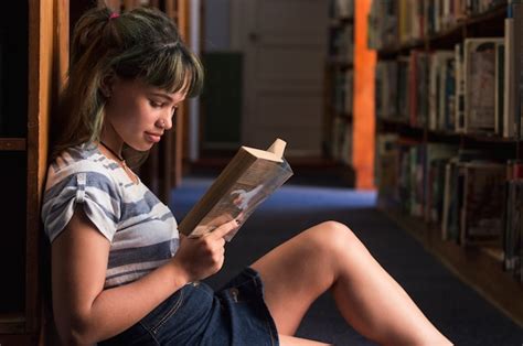 Reading Girl Sitting On Library Floor Free Photo