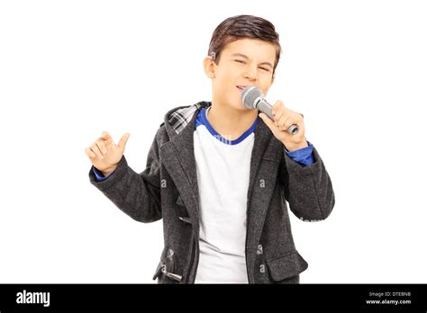 Boy singing on microphone Stock Photo - Alamy