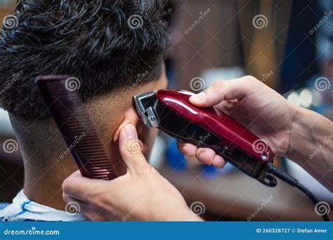 Close Up Shot Of Man Getting Trendy Haircut At Barber Shop Male