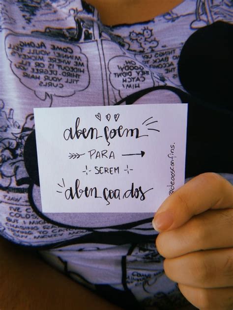 A Person Holding Up A Piece Of Paper With Writing On It That Says Adorn