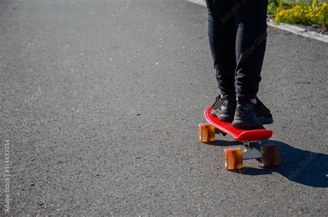 Little Girl Rides A Skateboard Body Parts Of The Leg Skateboard