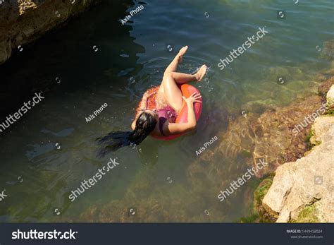Стоковая фотография Curvy Brunette Posing On Beach Shutterstock