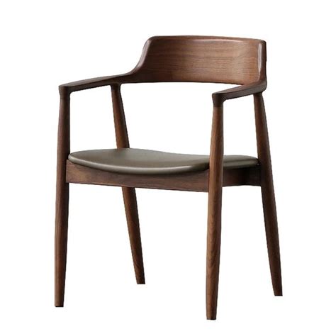 A Wooden Chair With Leather Seat And Armrests