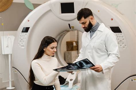 Ct Scan Radiologist Showing X Ray Of Abdomen To Girl Patient In