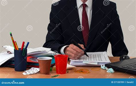 Busy Businessman Or Office Worker At Untidy Desk Royalty Free Stock