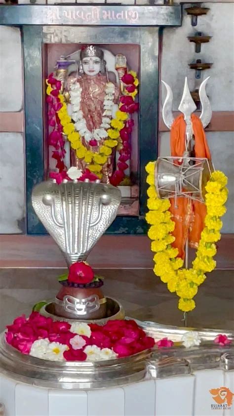 The Shrine Is Decorated With Flowers And Garlands