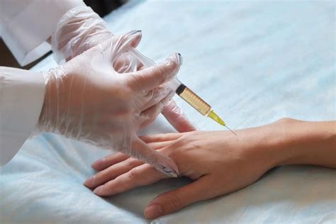 Premium Photo Doctor Doing Stem Cell Therapy On A Patients Elbow