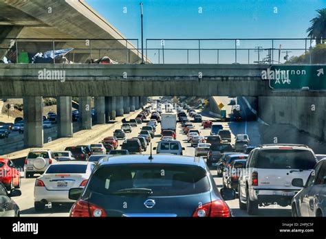 A Close Up Shot Of An Extremely Busy Two Lane Highway On A Clear Sunny