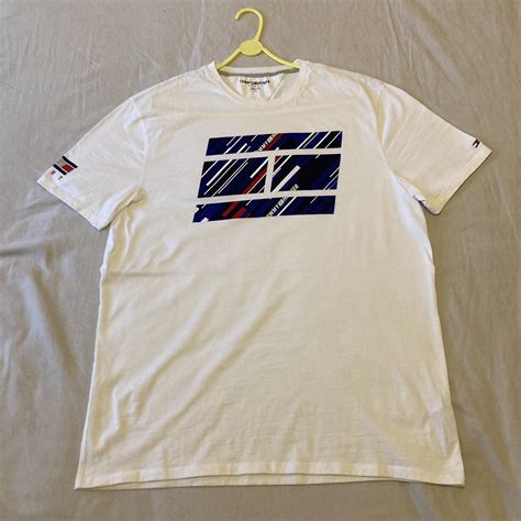 Tommy Hilfiger T-shirt in size L/G Old skool... - Depop