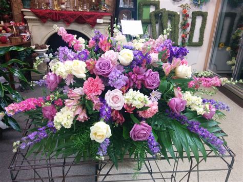 Cream Pink And Purple Casket Spray Funeral Flowers