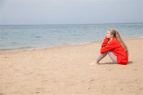 Beautiful Blonde Woman In Red Walks On Sandy Sea Beach Stock Image Image Of Beauty Nature