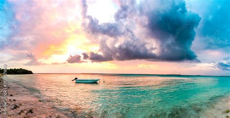 Beautiful Sunset View at Maldives Beach Colorful Sky and sea with alone boat best place to visit ...