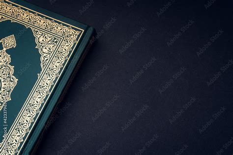 Holy Al Quran with written arabic calligraphy meaning of Al Quran on ...