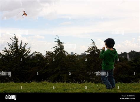 Boy Flying A Kite Stock Photo Alamy