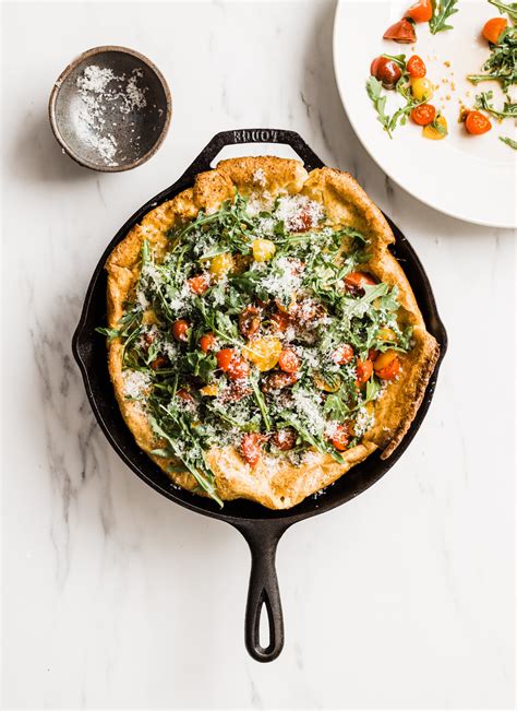 Black Pepper Parmigiano Dutch Baby With Arugula And Cherry Tomatoes