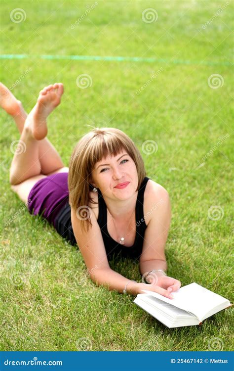 Girl reading book outdoors stock photo. Image of learn - 25467142