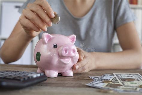 Putting Coin In Piggy Bank Stock Photo Image Of Finger