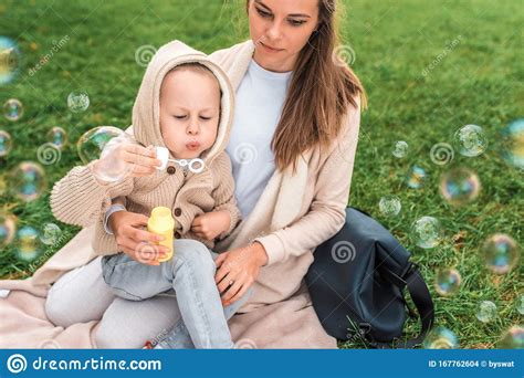 Little Boy Inflates Air Bubbles Woman Mom Plays With Child Summer