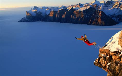 Man Jumping From Cliff At Daytime HD Wallpaper Wallpaper Flare