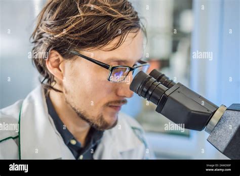 Portrait Of Caucasian Male Chemist Scientific Researcher Using