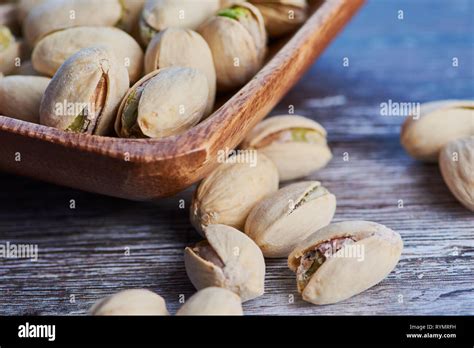 Macro Color Photo Of Pistachios In A Wooden Bowl Stock Photo Alamy