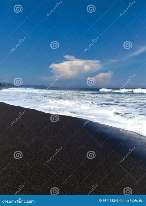 The Coast Of The Indian Ocean Of Black Volcanic Sand Amed Beach Bali