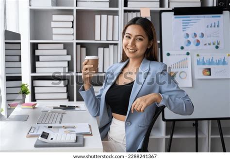 Young Professional Businesswoman Working While Having Stock Photo ...