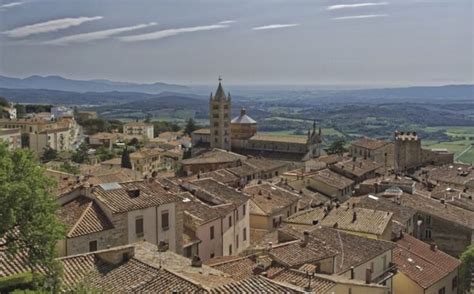 An Aerial View Of Some Buildings And Hills