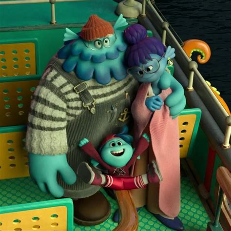 The Smurfs Are Sitting On Top Of Each Other In Front Of A Boat