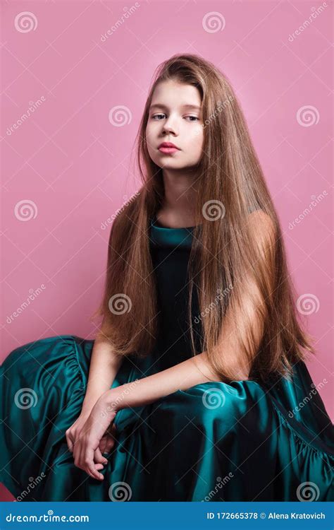 Young Beautiful European Girl Posing In Studio On Pink Background Stock