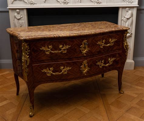 A Louis XV gilt bronze mounted bois de satiné commode en secrétaire