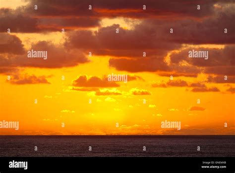 Spectacular Dramatic Orange Sunset Over The Ocean Stock Photo Alamy