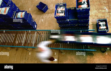 Warehouse conveyor belt in operation Stock Photo - Alamy