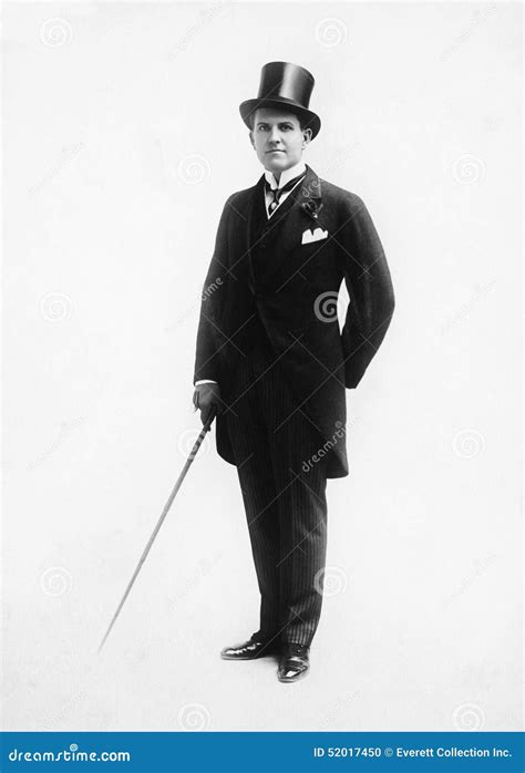 Portrait Of A Man In A Top Hat And Morning Suit Holding A Cane Stock