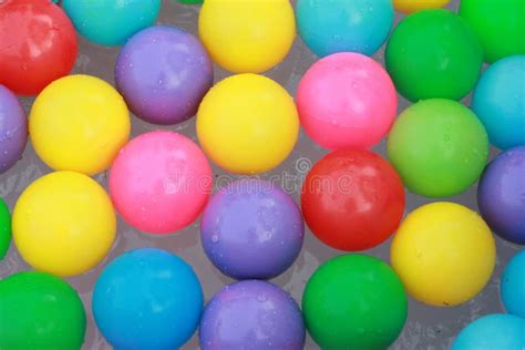 Colorful Plastic Balls Floating On The Water Stock Photo Image Of