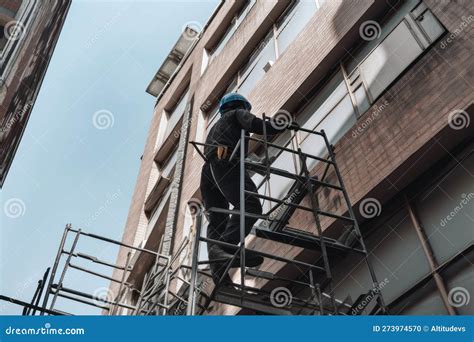 Person, Climbing Up Scaffolding To Reach the Top Floor of a Building ...