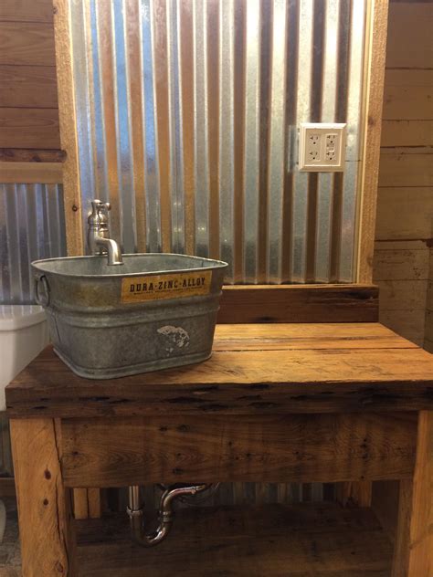 Corrugated tin walls with cypress vanity and galvanized bucket. | Rustic bathrooms, Rustic ...